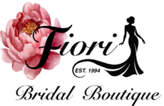 Fiori Bridal Boutique logo with pink flower, black silhouette bride, and &ldquo;EST. 1994&rdquo; text