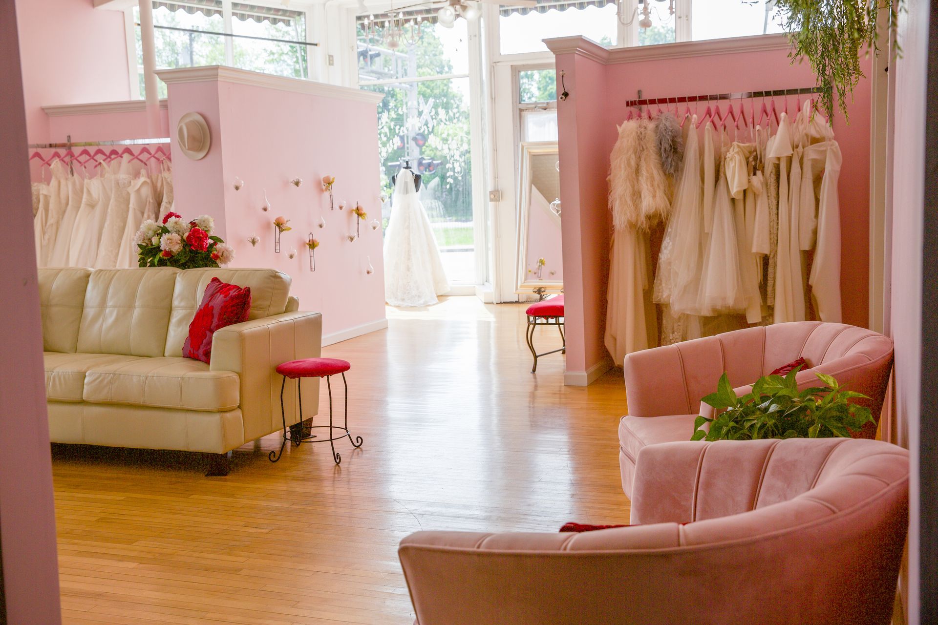 A living room with a couch and chairs in a bridal shop