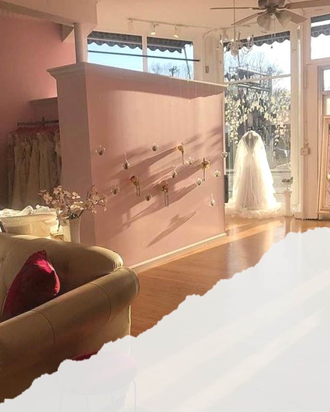 A wedding dress is on display in a bridal shop