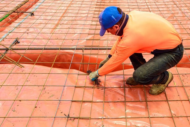 Construction Worker in Orange Shirt — Easy Mix Concrete In Central Coast, NSW
