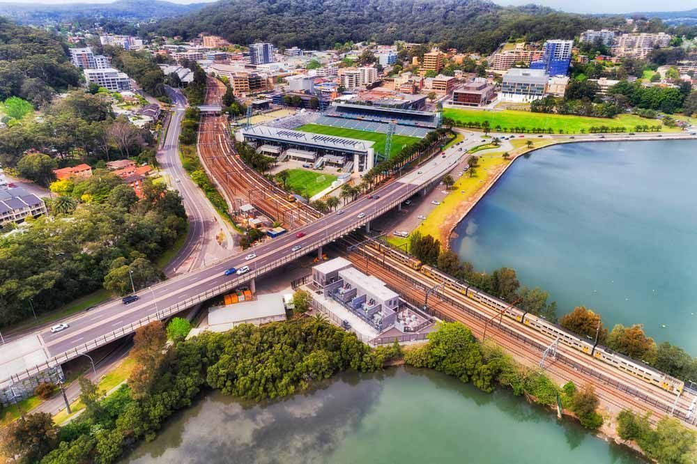 Aerial View of a City With Roadways, Train Tracks — Easy Mix Concrete In Gosford, NSW