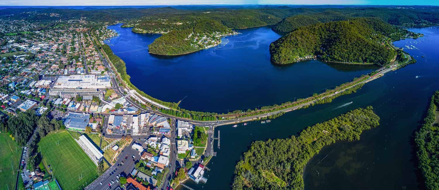 Aerial View of a Town on a Shoreline Next to a Large Blue Body — Easy Mix Concrete In Woy Woy, NSW