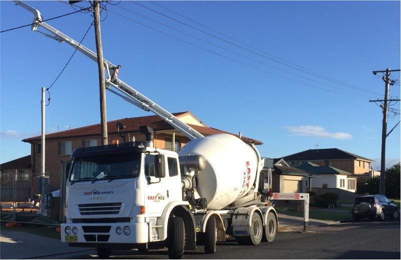 Cement Truck With an Extended Arm — Easy Mix Concrete in Berkeley Vale, NSW