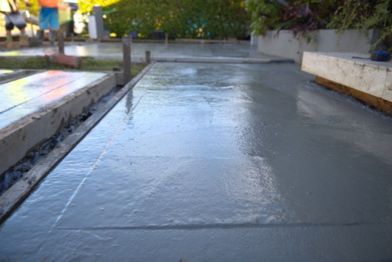 Freshly Poured Concrete Slab in a Garden — Easy Mix Concrete in Berkeley Vale, NSW