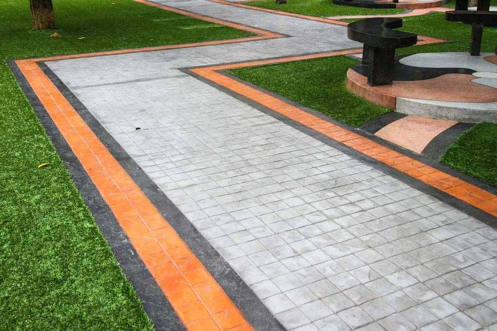 Paved Walkway With Orange and Black Borders — Easy Mix Concrete In Berkeley Vale, NSW