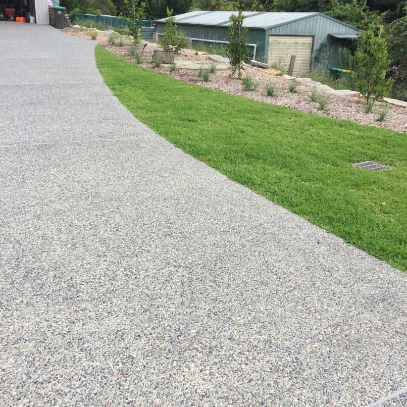 Gravel Driveway Curves Beside a Green Lawn — Easy Mix Concrete in Berkeley Vale, NSW