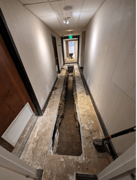 A long hallway with a hole in the floor