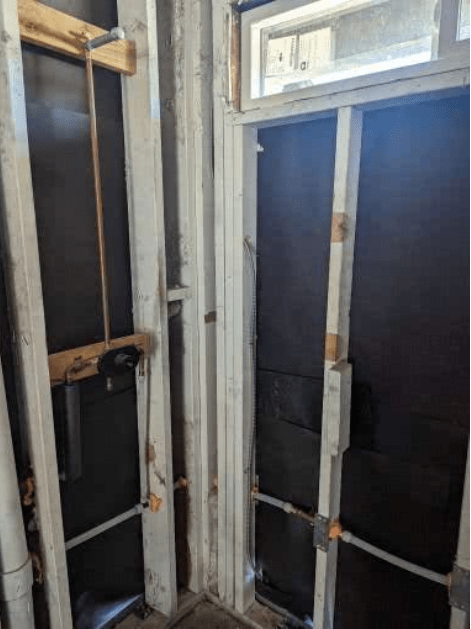 A room with a door and a window in it.