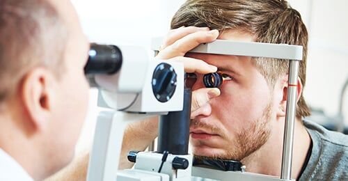 Man Taking Eye Exams—Eye Doctor in Edina, MN Man Taking Eye Exams—Eye Doctor in Edina, MN