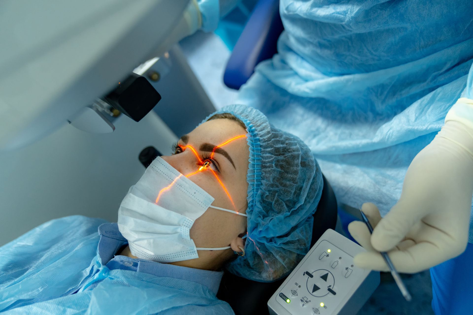 A female patient goes through eye laser correction inside a surgery room.