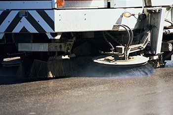 Truck on cleaning asphalt — Street Sweeping Projects in Dallas, TX