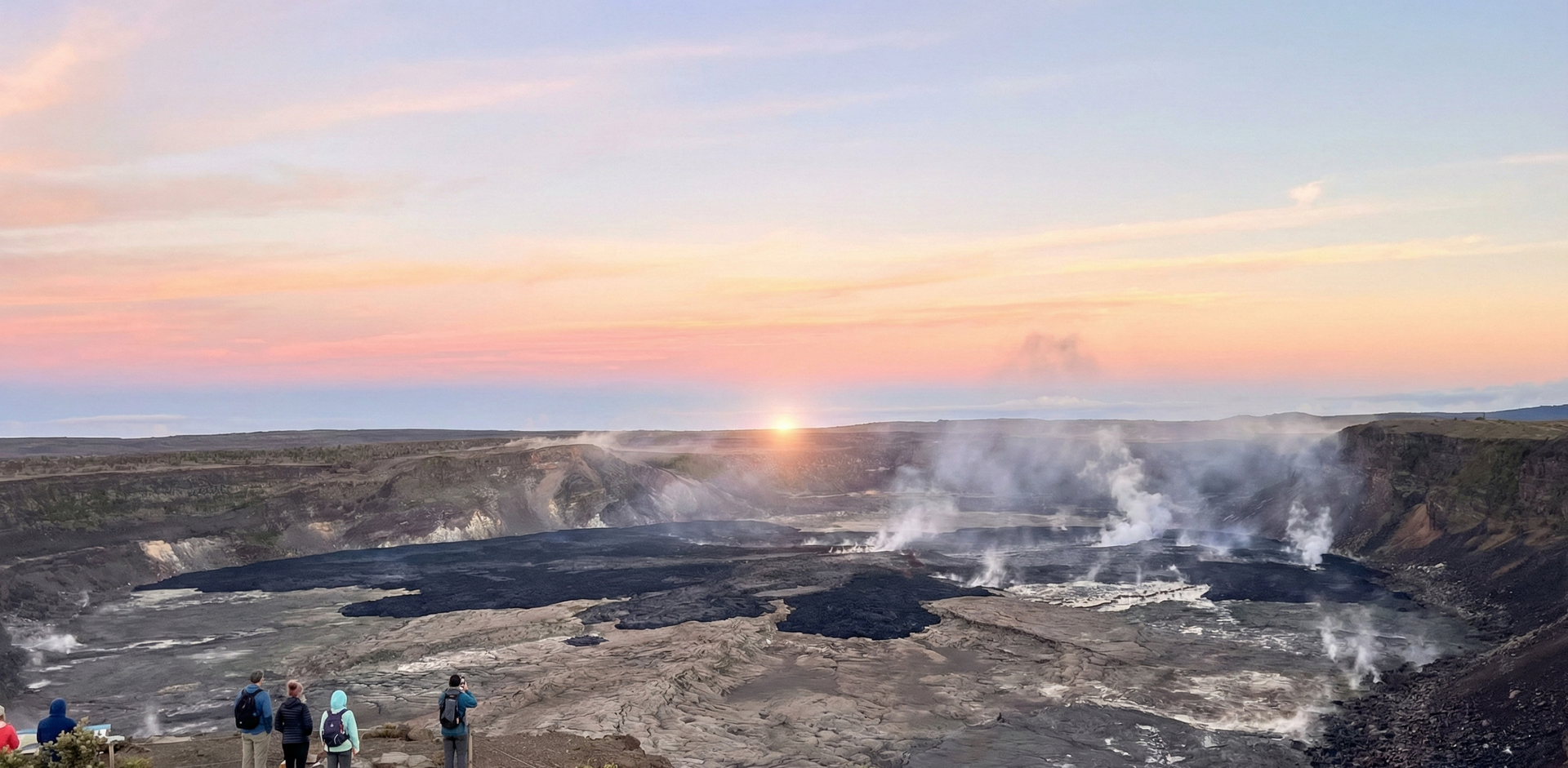 Sunrise over the steaming, black lava floor of Kīlauea Iki.