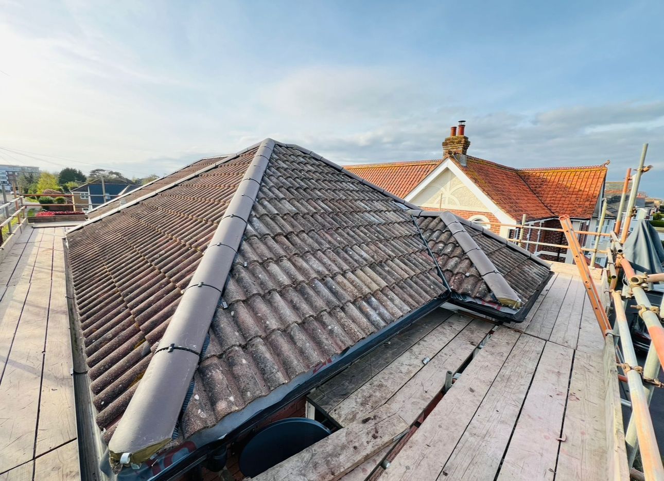 A roof is being built on top of a wooden scaffolding.