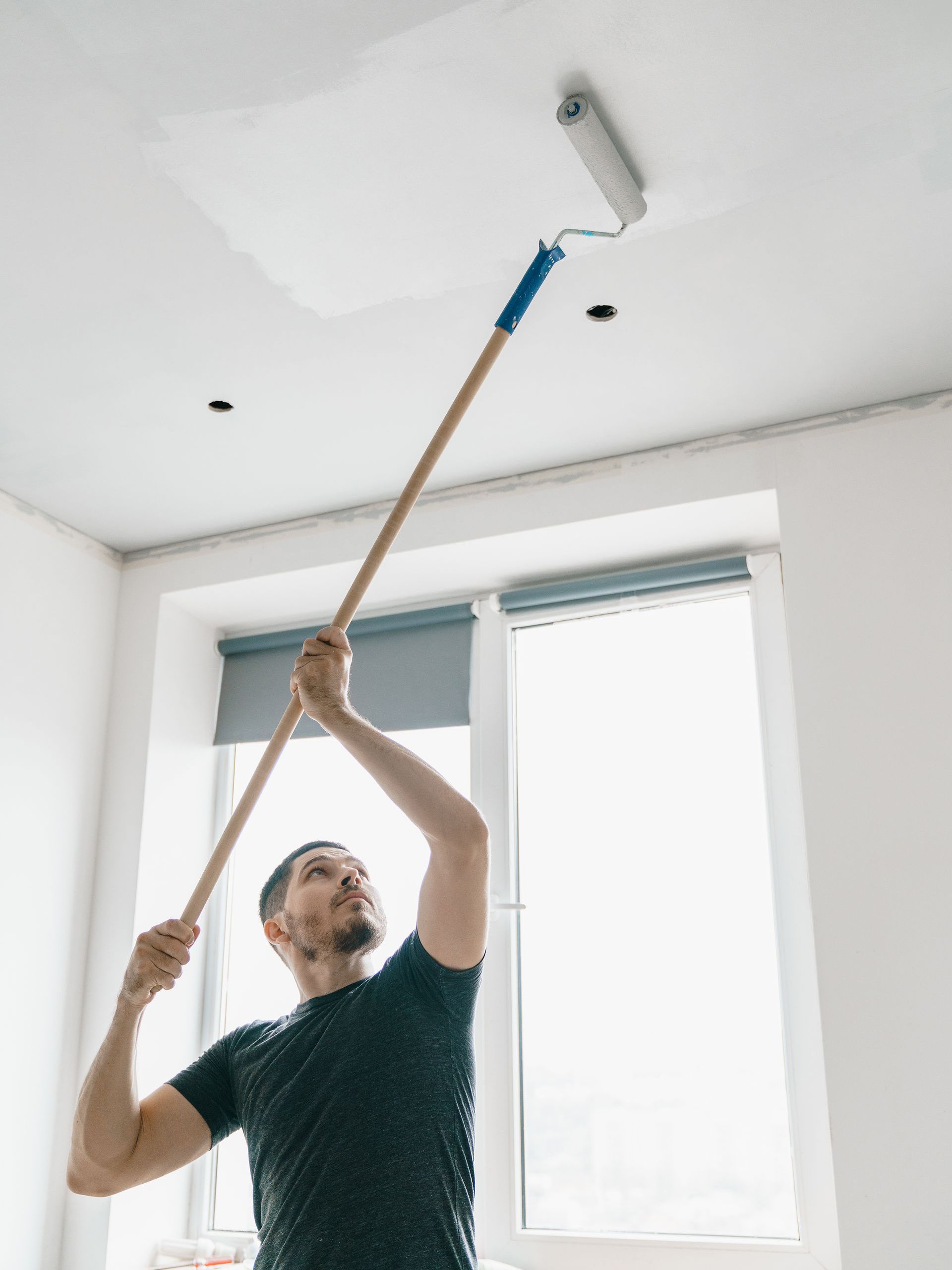 professional residential painter painting ceiling