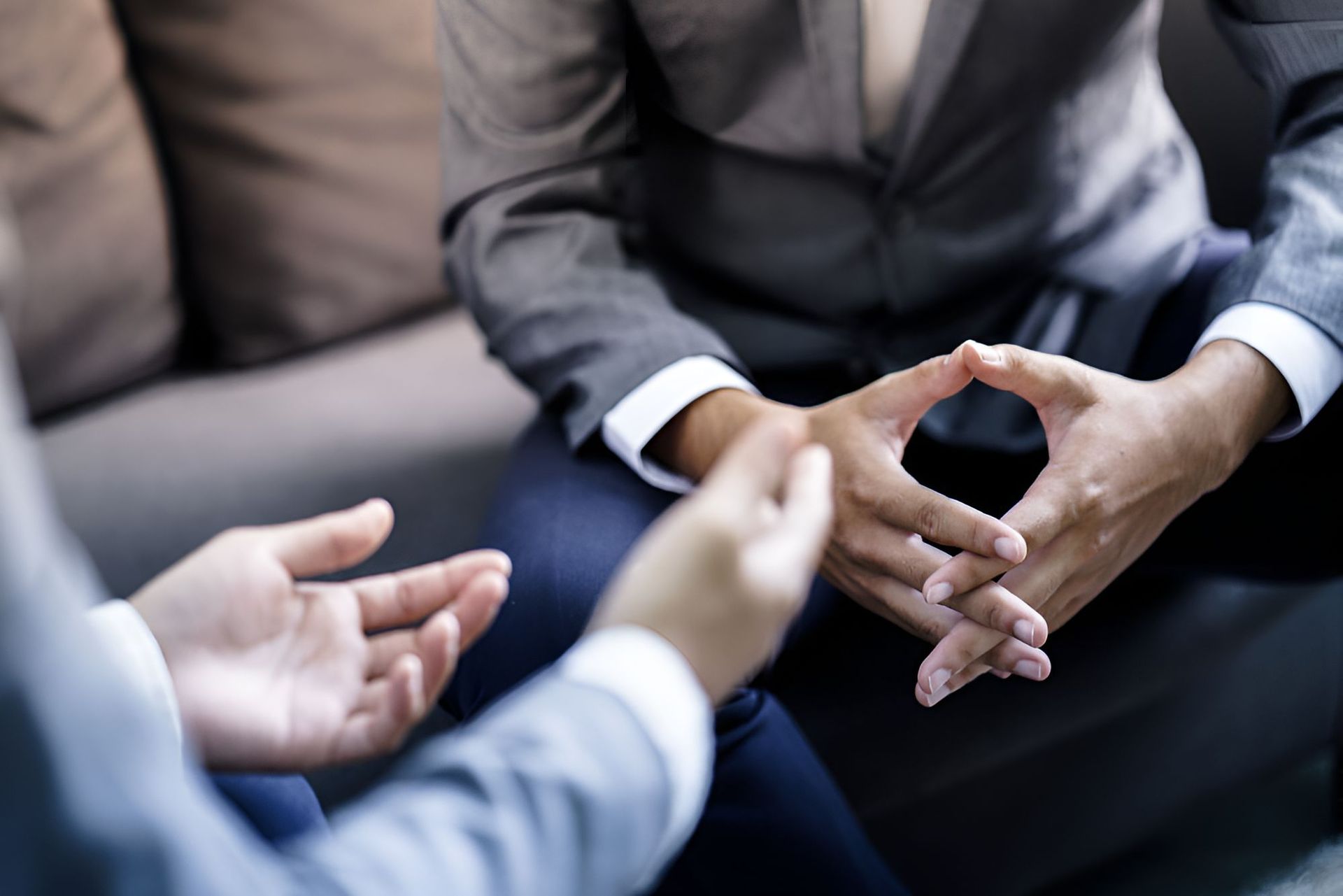 People Sitting On A Couch Talking To Each Other — Michael Andrews Taxation & Accounting Services In Pacific Paradise, QLD
