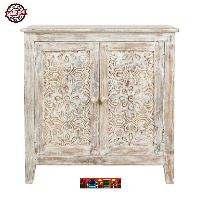 Small whitewash cabinet with 2 etched scroll front doors.