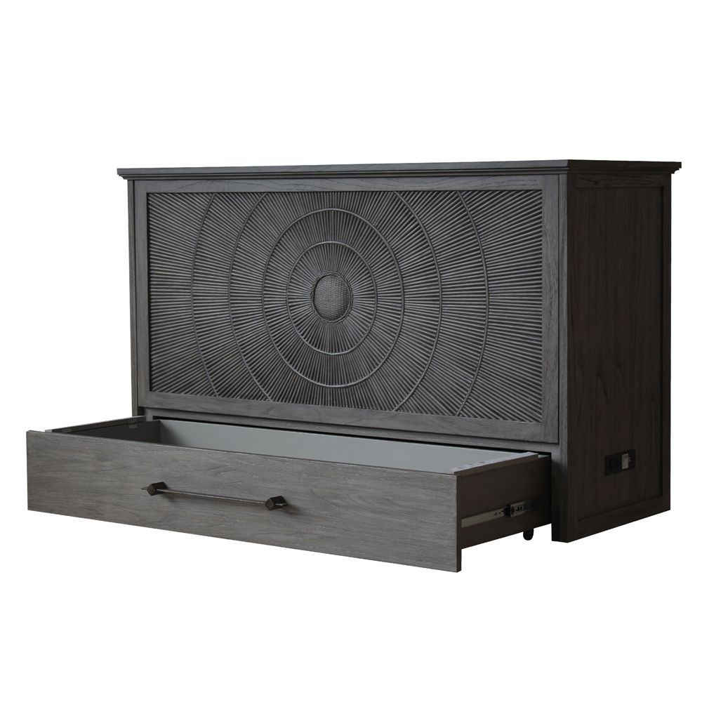 Dark Grey Cabinet bed with a bullseye rattan pattern front panel. Bottom drawer with black iron handle. Corner angle showing the power supply on the bottom side panel and the bottom drawer open.