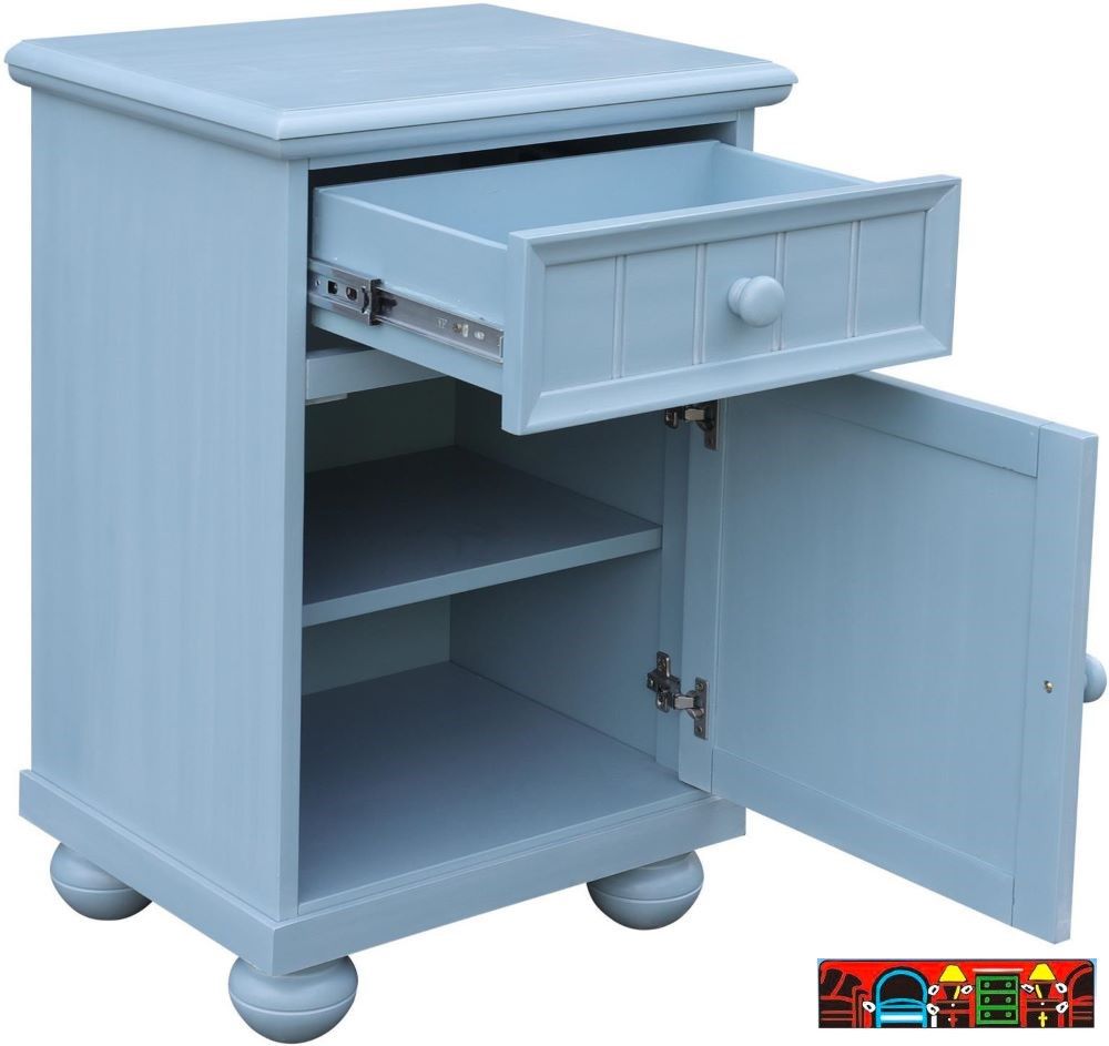 The Beachfront Door Nightstand in Ocean Blue brings unique style with maximum beside storage to your bedroom. On top is a drawer with recessed front and beading, and the door below showcases hand-placed shutters adding to its cottage feel. Opened.