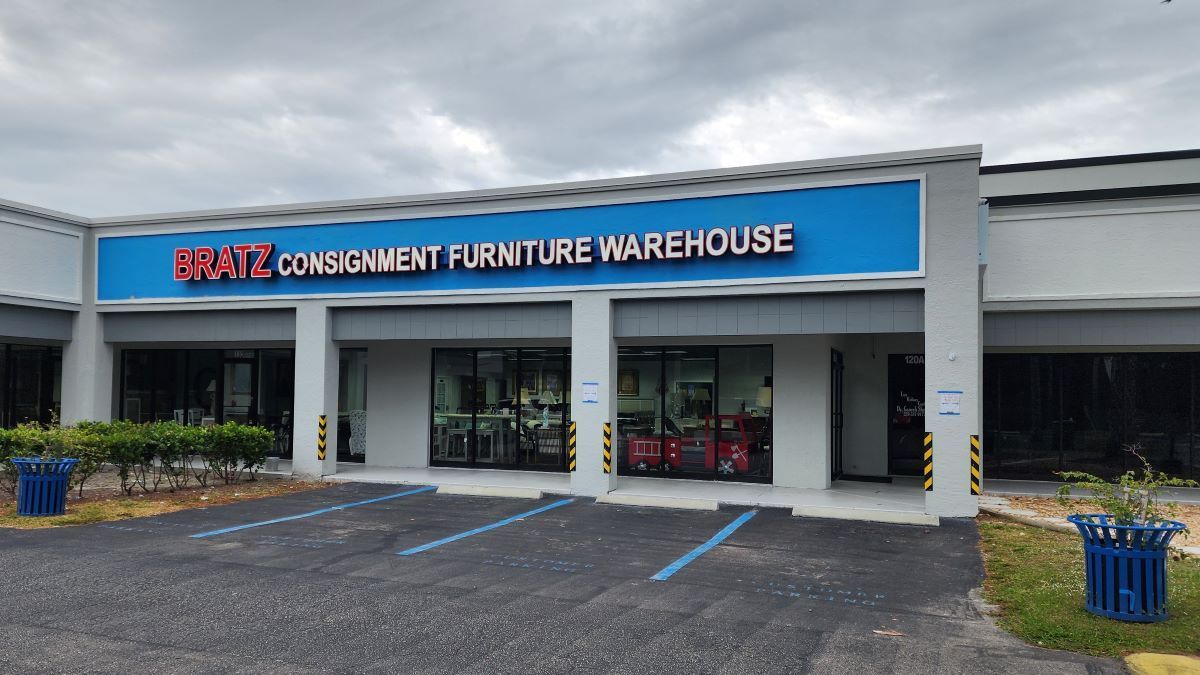 Bratz Consignment Furniture Warehouse, located at 14181 S Tamiami Trail, offers a wide selection of top-quality new and pre-owned furniture, new mattresses, and model home accessories, with the largest collection of coastal style furnishings in Southwest Florida. Open seven days a week, they provide free delivery and have been serving the community since 1992.