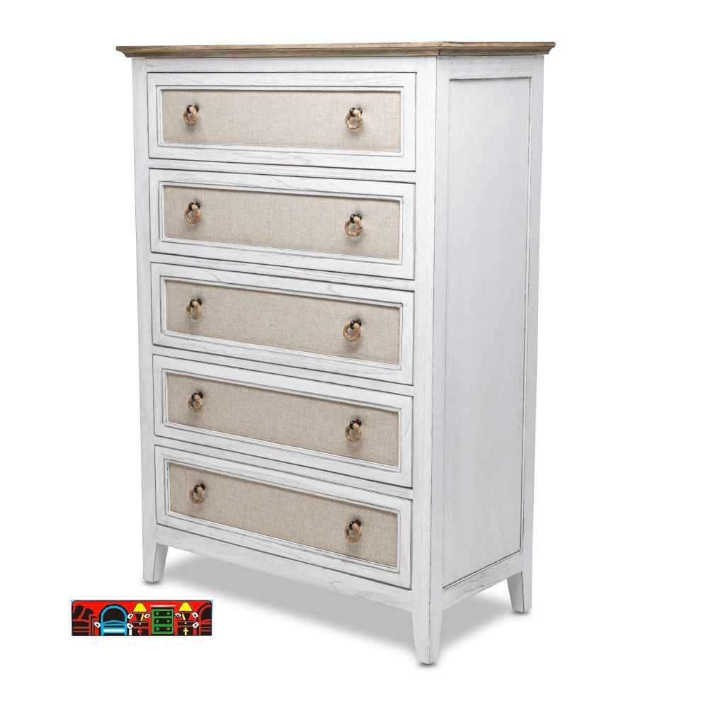 The Captiva Island bedroom chest features a coastal design with a distressed white and beach sand finish. It includes five drawers adorned with outdoor fabric fronts and woven knobs.