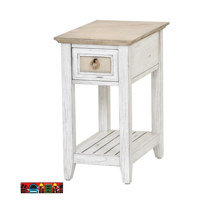 The Captiva Island chairside table features a coastal design with a distressed white and beach sand finish. It includes one drawer with an outdoor fabric front, a woven knob, and a lower shelf for additional storage.