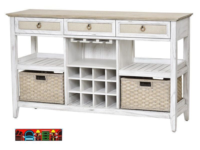 The Captiva Island sideboard features a wine rack, a coastal design with a distressed white and beach sand finish, three drawers with outdoor fabric fronts, woven knobs, two shelves, and two baskets.