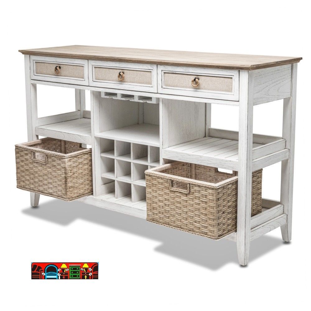 The Captiva Island sideboard features a wine rack, a coastal design with a distressed white and beach sand finish, three drawers with outdoor fabric fronts, woven knobs, two shelves, and two baskets. Angled View.