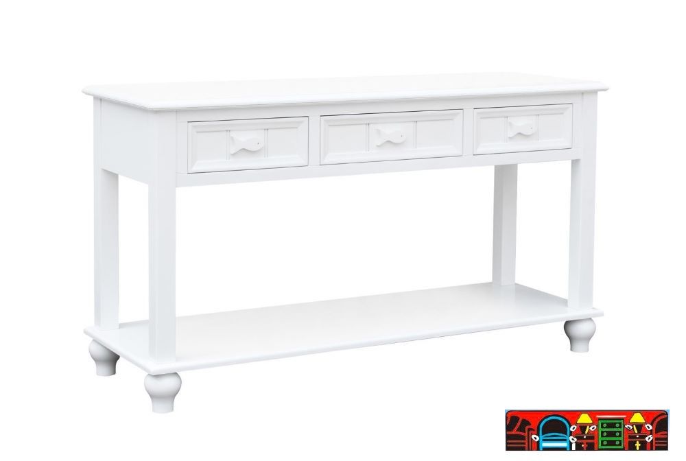 The Fishtails Sofa Table, crafted from wood and finished in white. Features Three drawers and a shelf. It is available at Bratz-CFW in Fort Myers, FL.
