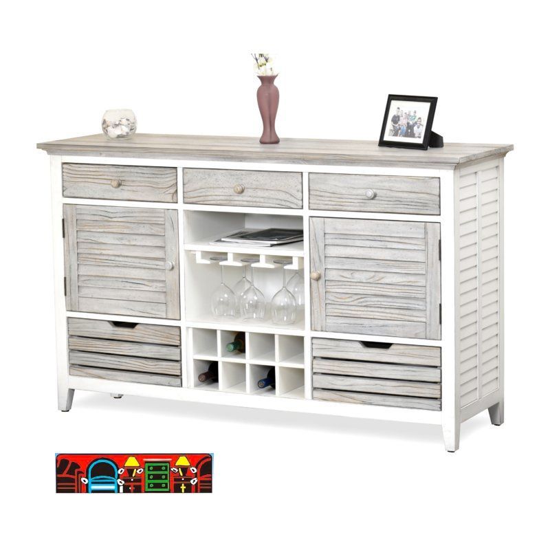 Sideboard in white with distressed grey accents, featuring louvered sides, three drawers, two doors, and shelves behind them, complete with a stemware hanger.