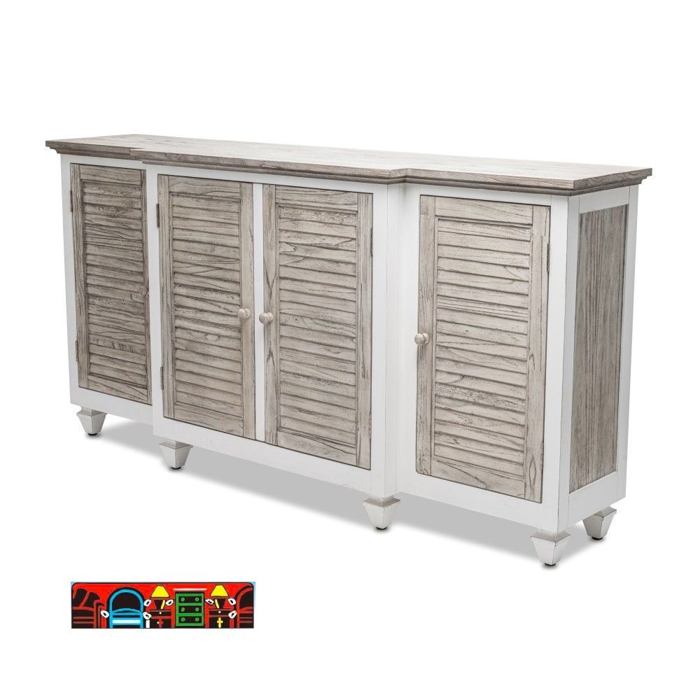 Islamorada credenza with four shutter doors in a distressed gray and white finish, featuring a protruding center section and shelves behind.