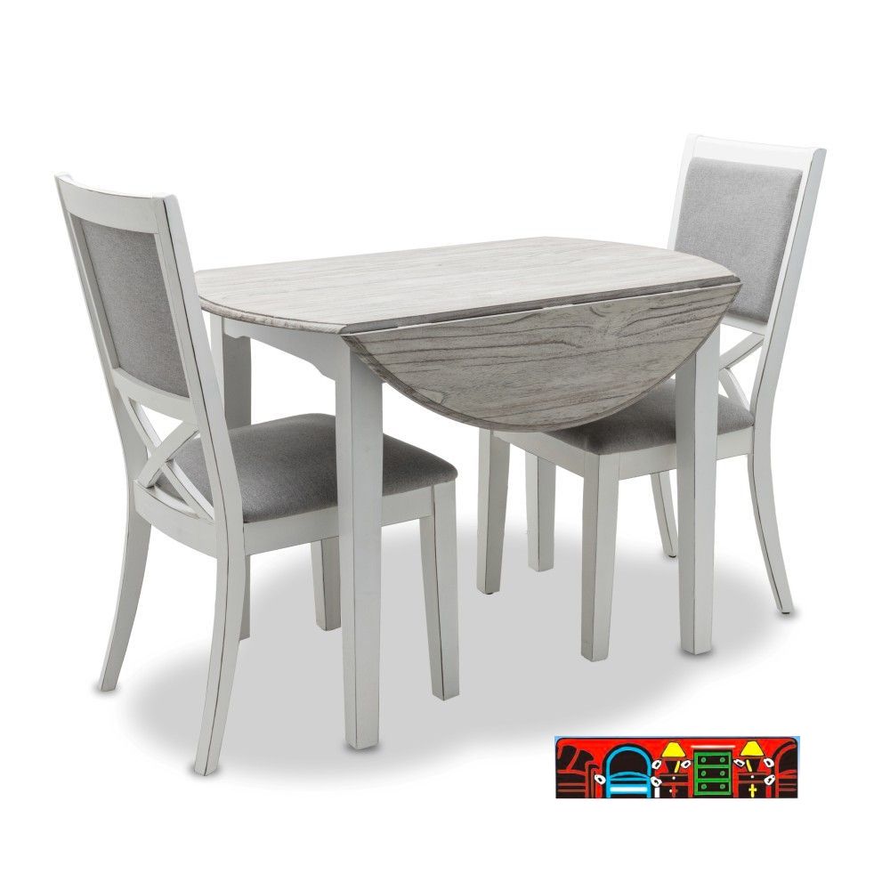 Islamorada 'Three-piece dinette set in white and distressed grey, featuring a drop-leaf table and two side chairs with shutter backs and grey cushions.'
