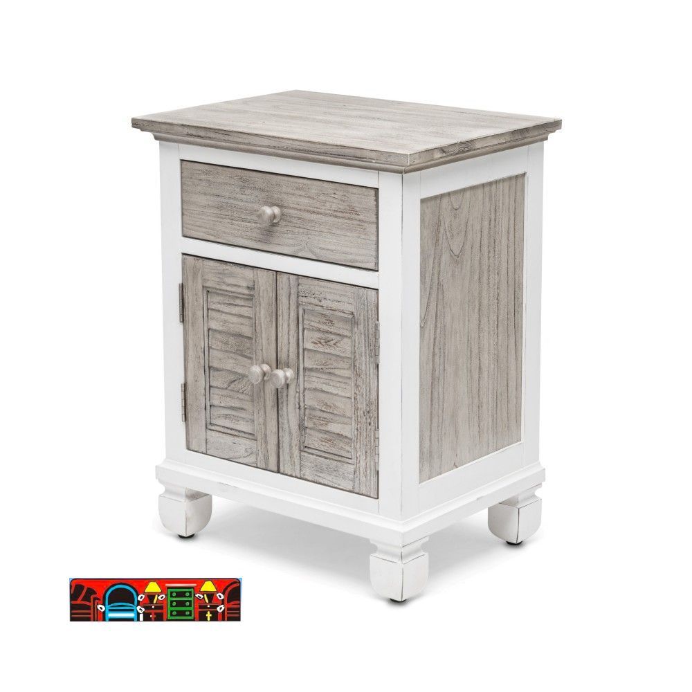 The Islamorada nightstand features a coastal design, crafted from wood with one drawer and two doors. It showcases a white and distressed grey finish, complete with shutter accents.