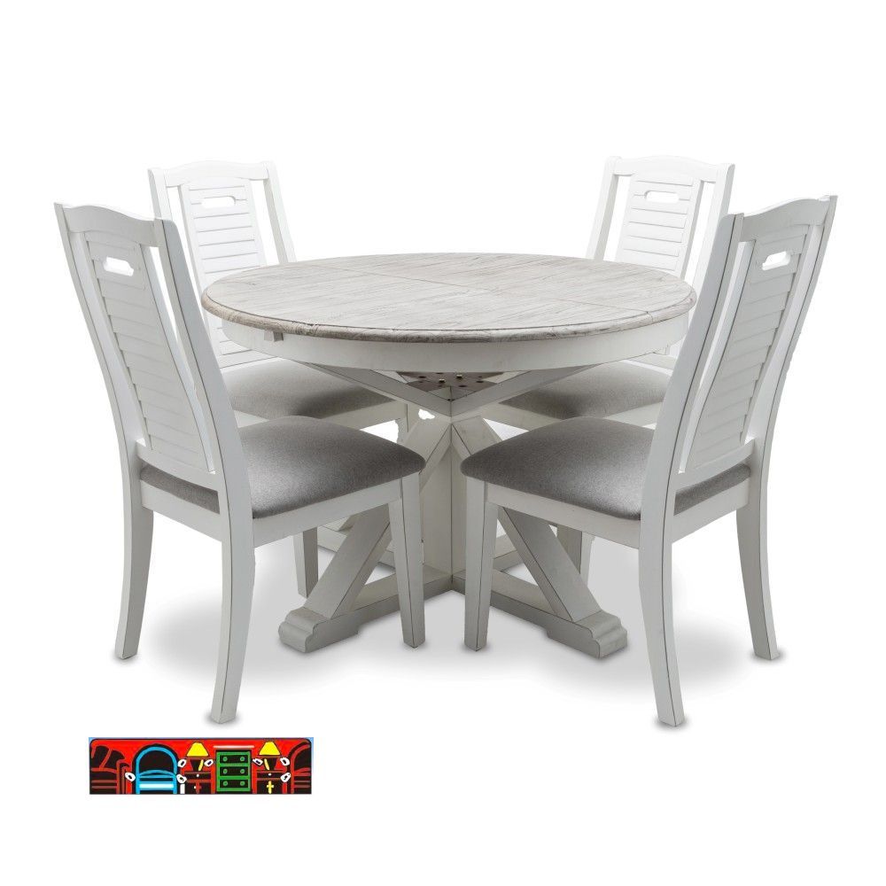 The Islamorada 5-piece dining set features a wooden construction with a white frame and a distressed grey top. It includes a butterfly leaf and four side chairs with shutter backs.