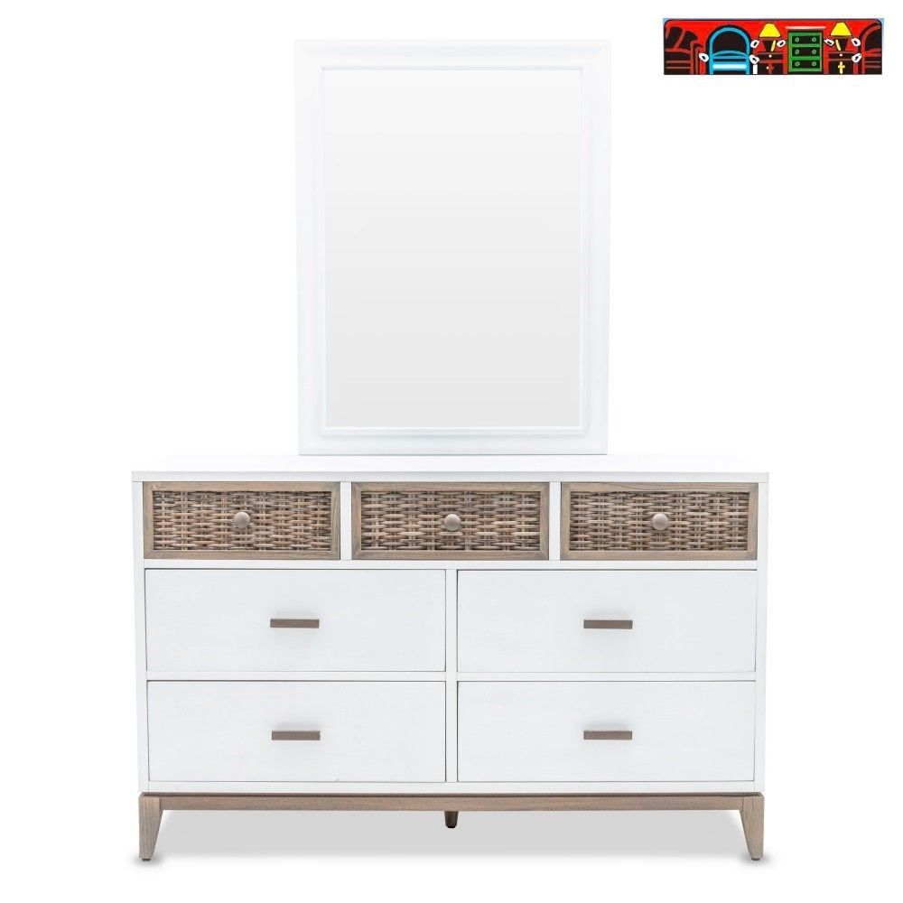 The Kauai Dresser and mirror set features a coastal design with a white, weathered wash finish, wicker accents and base.