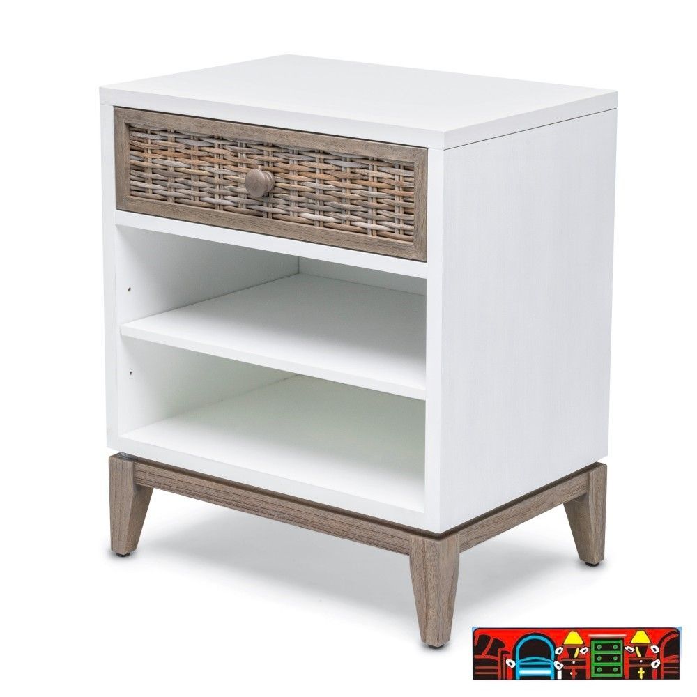 The Kauai Nightstand features a coastal design with a white, weathered wash finish, wicker accents and base.