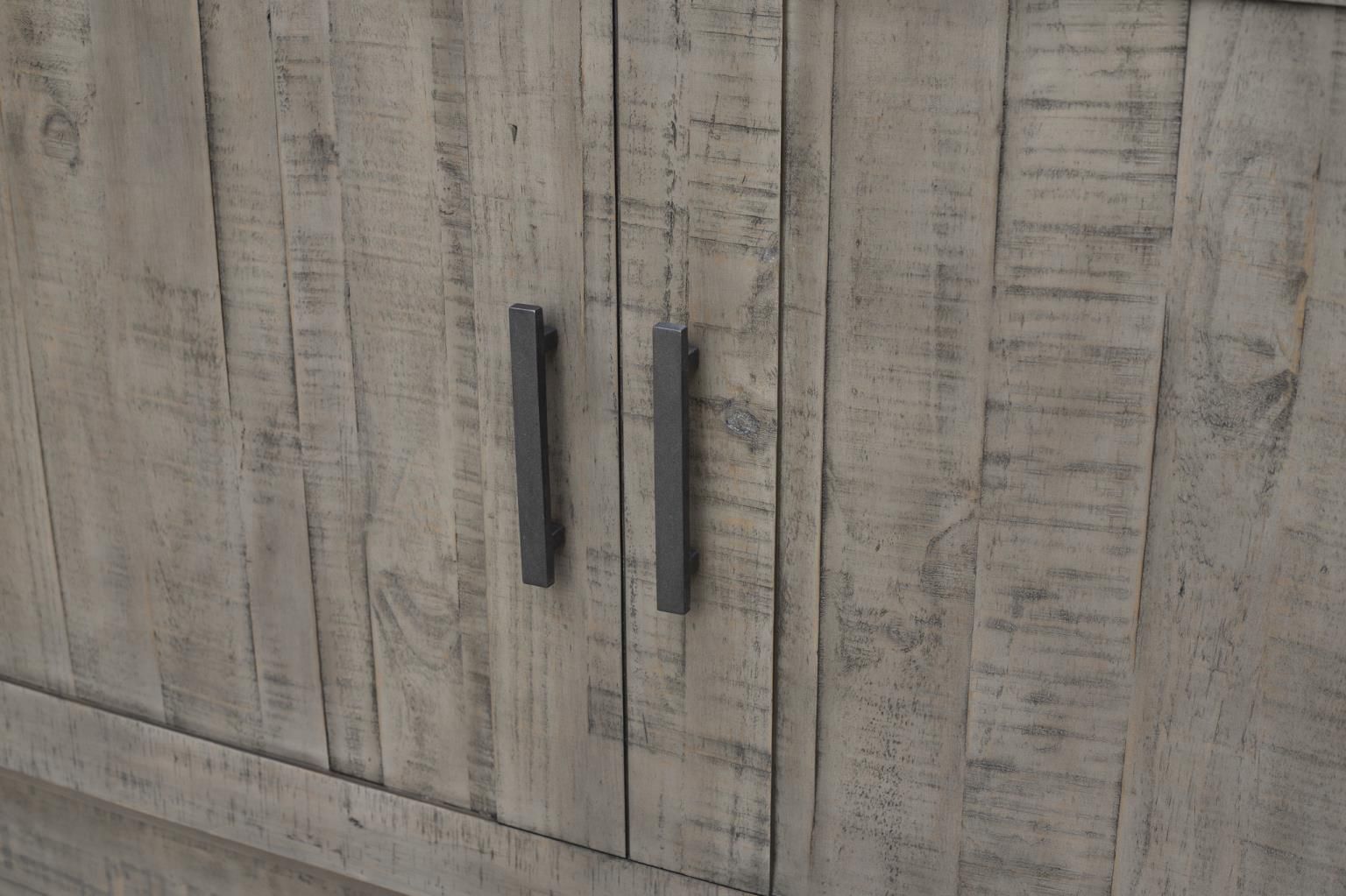 Medium grey wood with a rustic look cabinet bed with visible black hardware & decorative handles. Drawer at the bottom. Close-up of decorative handles