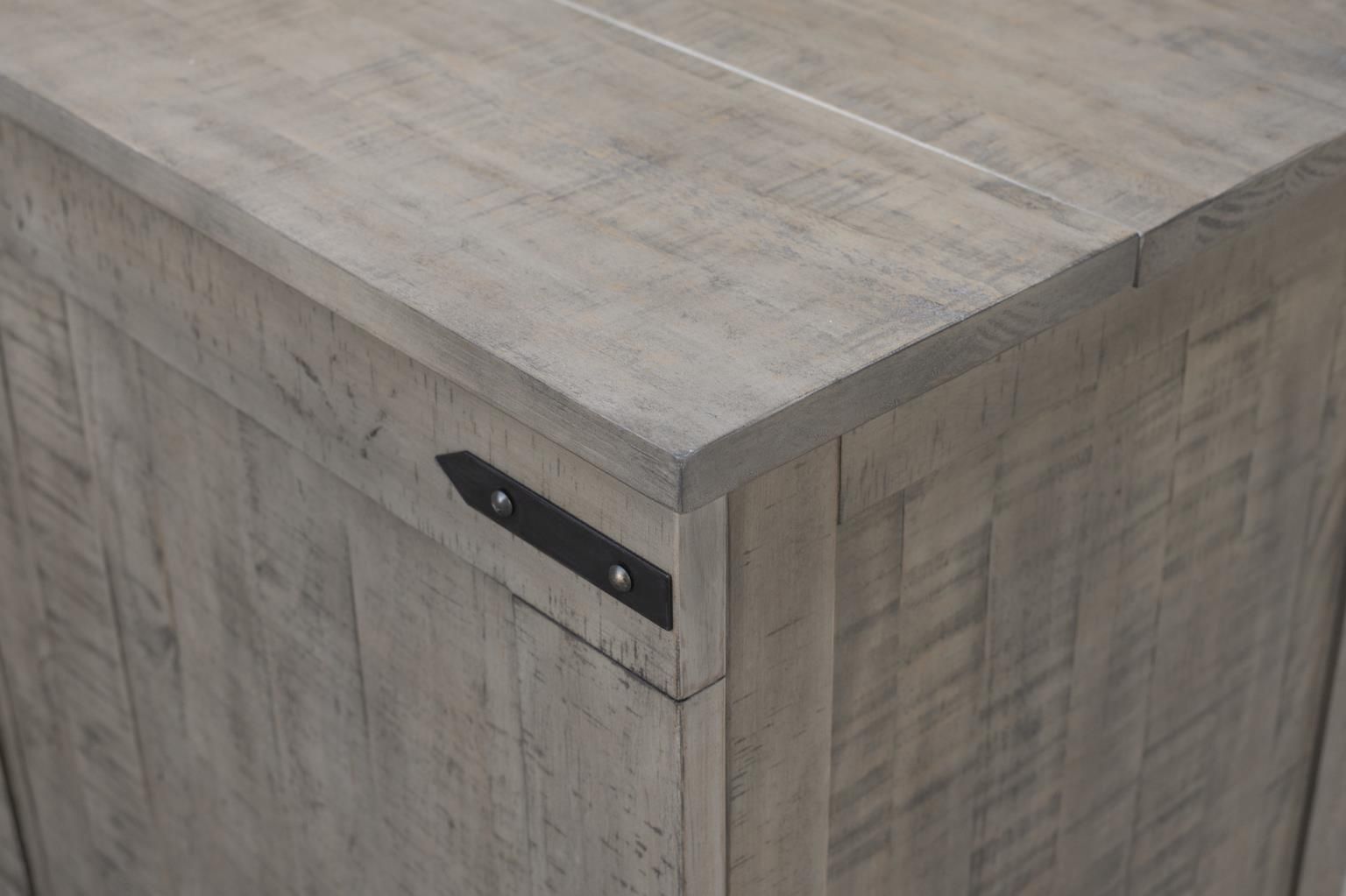 Medium grey wood with a rustic look cabinet bed with visible black hardware & decorative handles. Drawer at the bottom. Close-up of decorative hardware.