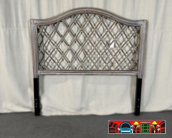 A rattan headboard in grey-wash color and full size, featuring a crisscross design.