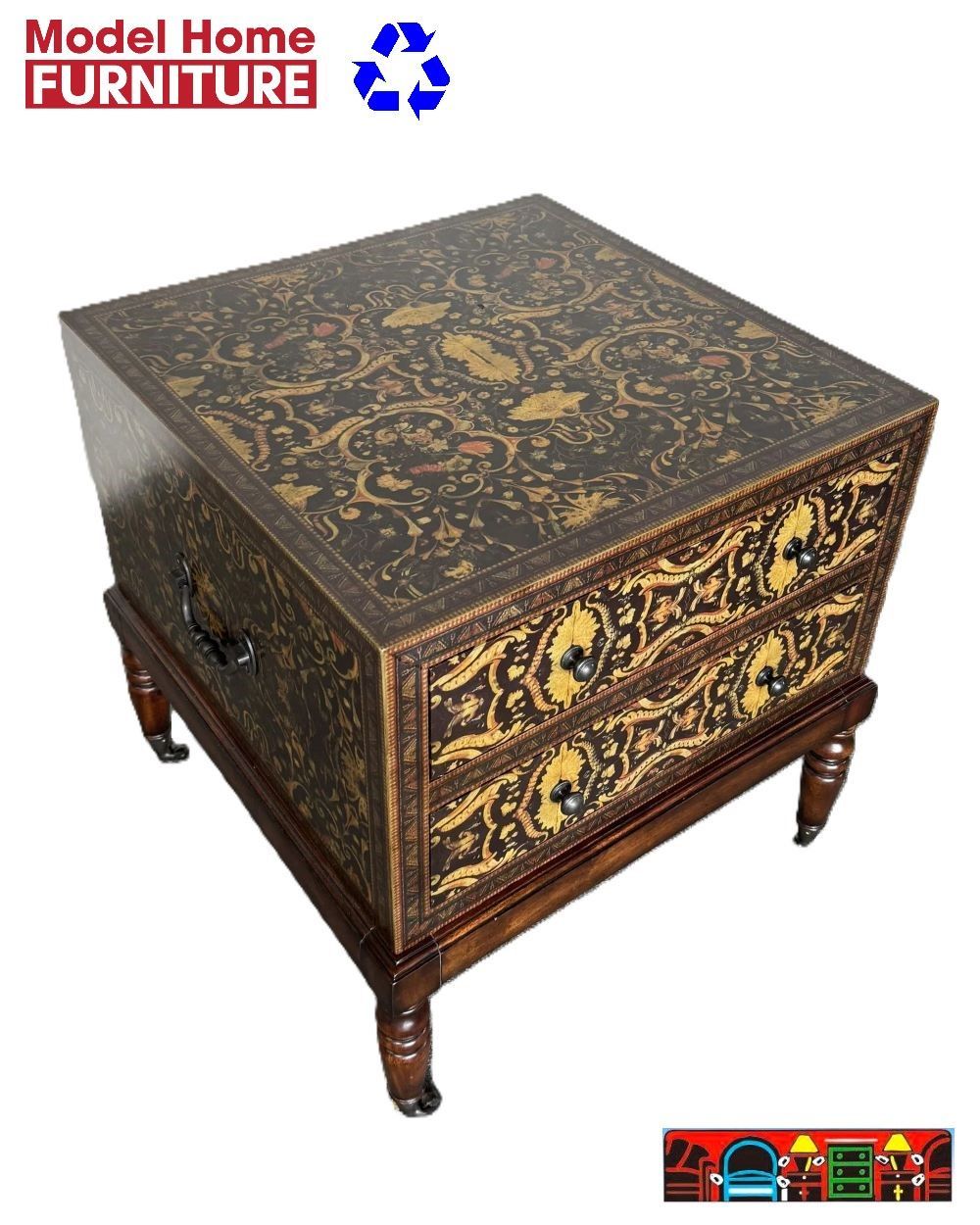 The Theodore Alexander hand-painted trunk end table features a brown background with an intricate design and is available at Bratz-CFW in Fort Myers, FL.