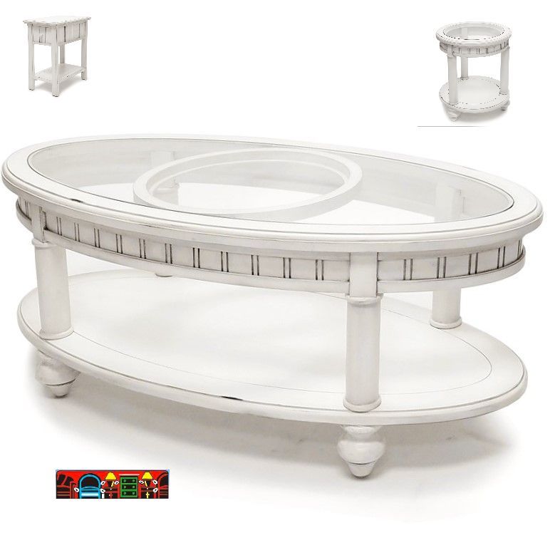An oval cocktail table featuring a distressed white finish, stylish column-like legs, a decorative apron, a lower shelf, and a glass tabletop.