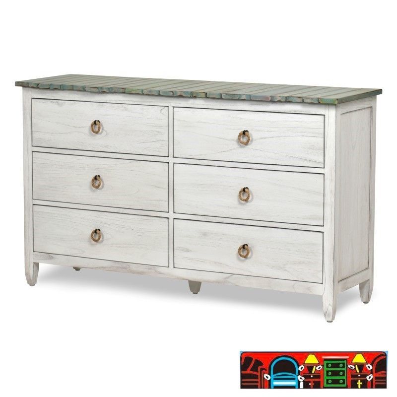 The Picket Fence Bedroom Dresser offers a coastal charm with its solid wood construction, distressed white finish, weathered blue top, and rope pulls. Available at Bratz-CFW.