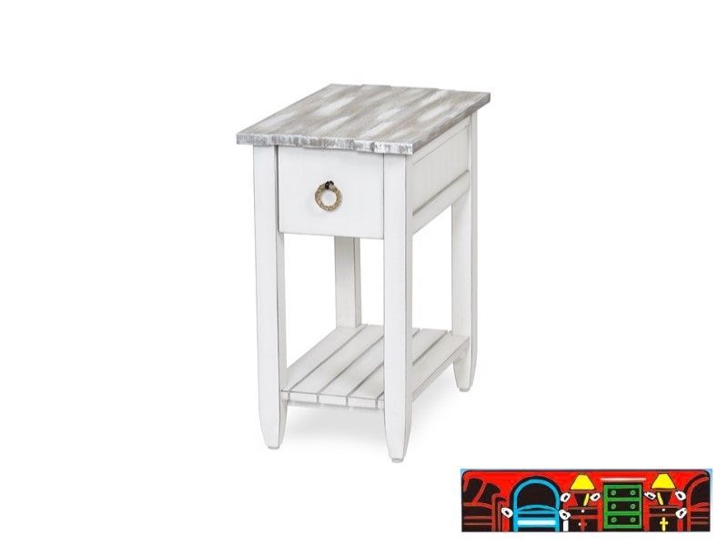 The Picket Fence Chairside Table offers a coastal charm with its solid wood construction, distressed white finish, weathered grey top, and rope pull. Available at Bratz-CFW.