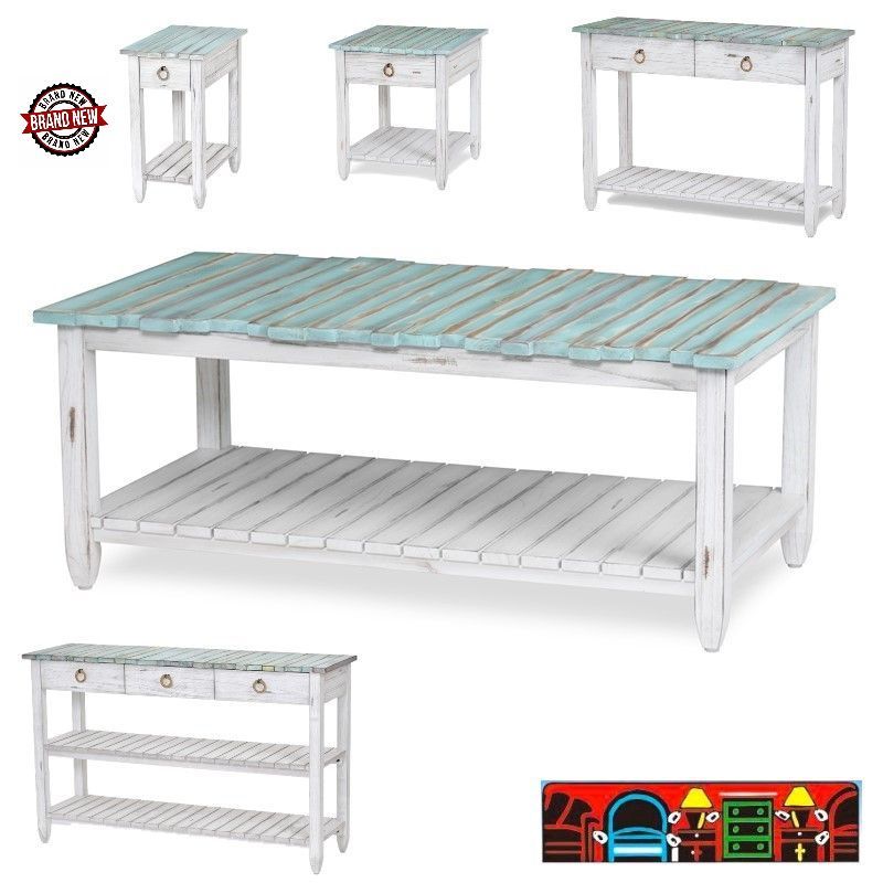 The Picket Fence Occasional Tables offer a coastal charm with its solid wood construction, distressed white finish, weathered blue tops, and rope pulls. Available at Bratz-CFW.