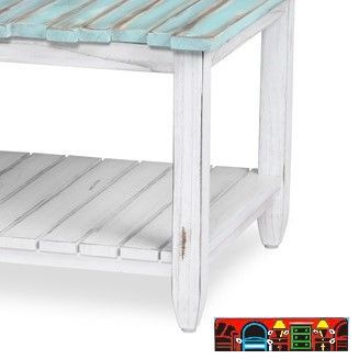 The Picket Fence Occasional Tables offer a coastal charm with its solid wood construction, distressed white finish, weathered blue tops, and rope pulls. Available at Bratz-CFW. Base Close-Up.