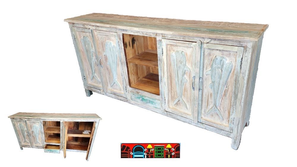 'A multicolored entertainment console crafted from solid reclaimed wood, featuring four doors each adorned with a carved mahi fish, complemented by a central bottom drawer and a shelf concealed behind the doors. The piece is finished with iron handles.'