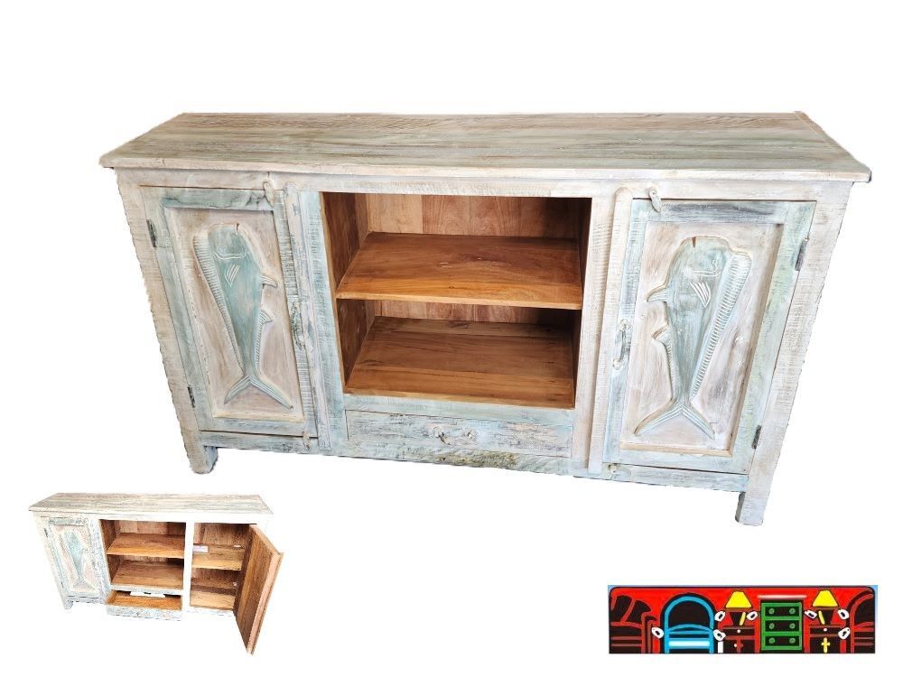 'This media console is crafted from solid reclaimed wood and features intricately carved mahi fish on its two doors, which open to reveal a shelf. The unit also includes a central bottom drawer, an additional shelf above it, and is supported by elevated legs.'