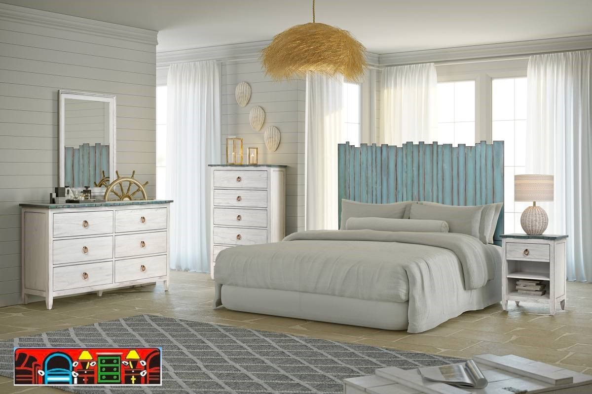The Picket Fence Bedroom Set offers a coastal charm with its solid wood construction, distressed white finish, weathered blue tops, and rope pulls. Available at Bratz-CFW.