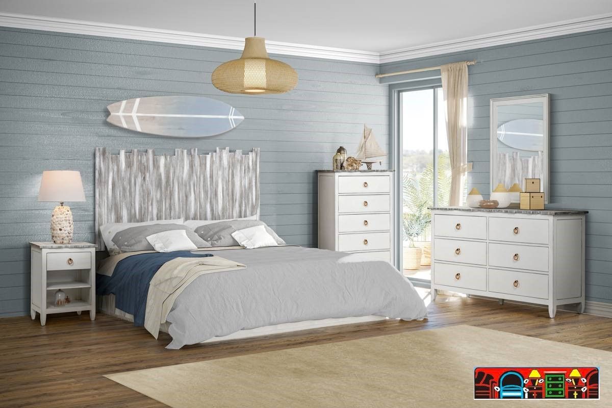 The Picket Fence Bedroom Set offers a coastal charm with its solid wood construction, distressed white finish, weathered grey tops, and rope pulls. Available at Bratz-CFW.