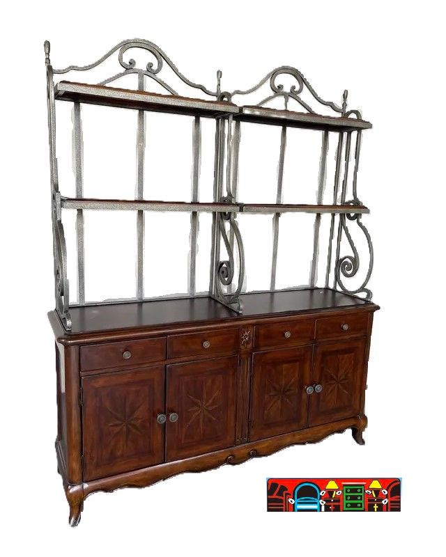 A spacious wooden baker's rack that features four drawers and four doors with iron details and glass shelves