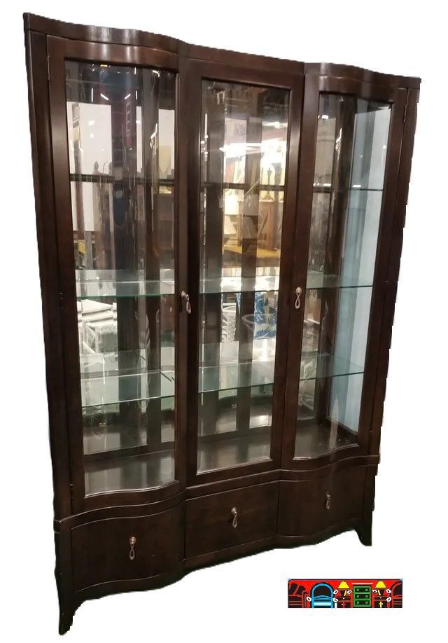 Large dark brown scalloped front 4-door curio with 2 bottom drawers and mirror back.